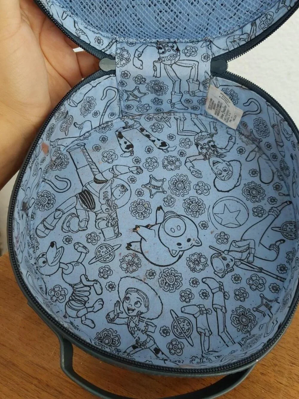 round Vera Bradley Disney Pixar Whimsy Cosmetic Case in the Andy's Room pattern
